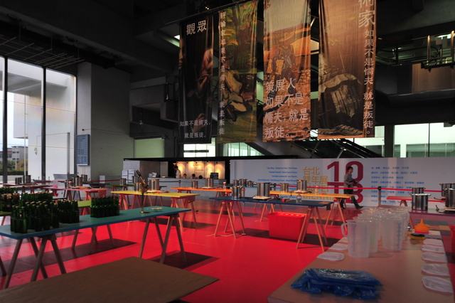 a restaurant filled with tables and chairs with colorful chairs