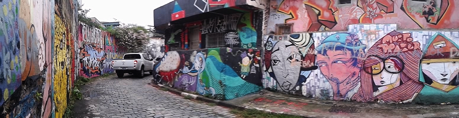 the streets are filled with many graffiti covered buildings