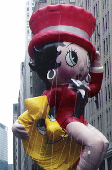 the giant, cartoon character appears to be carrying items