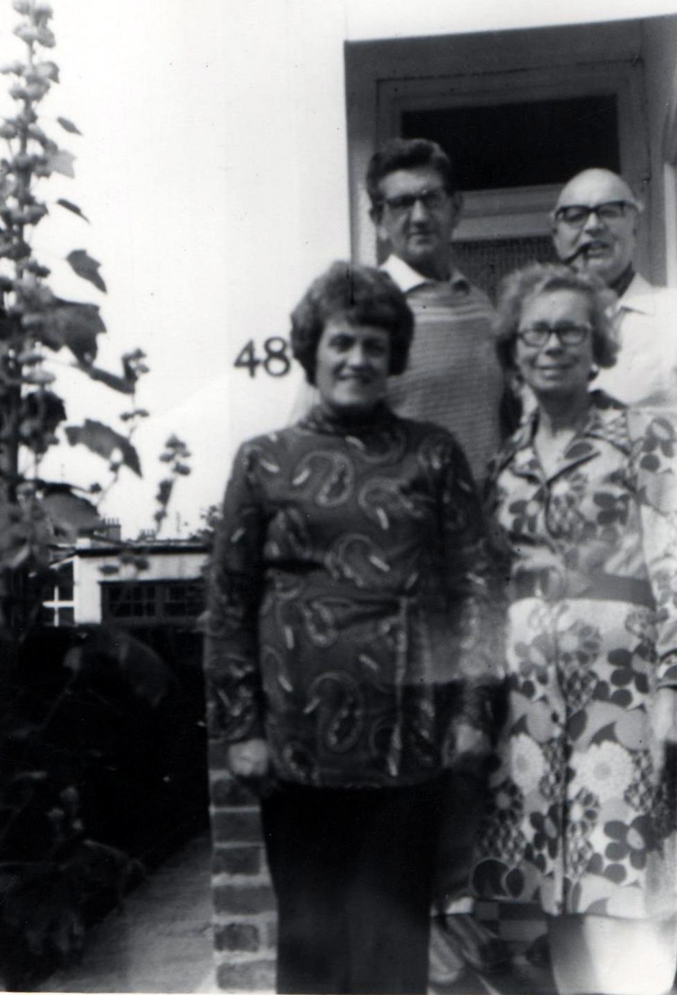 an old black and white po of four people