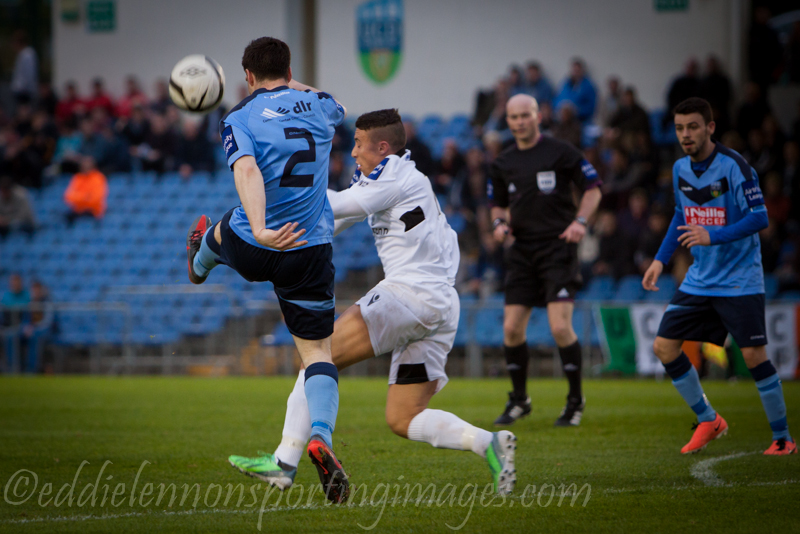 a couple of men playing a game of soccer