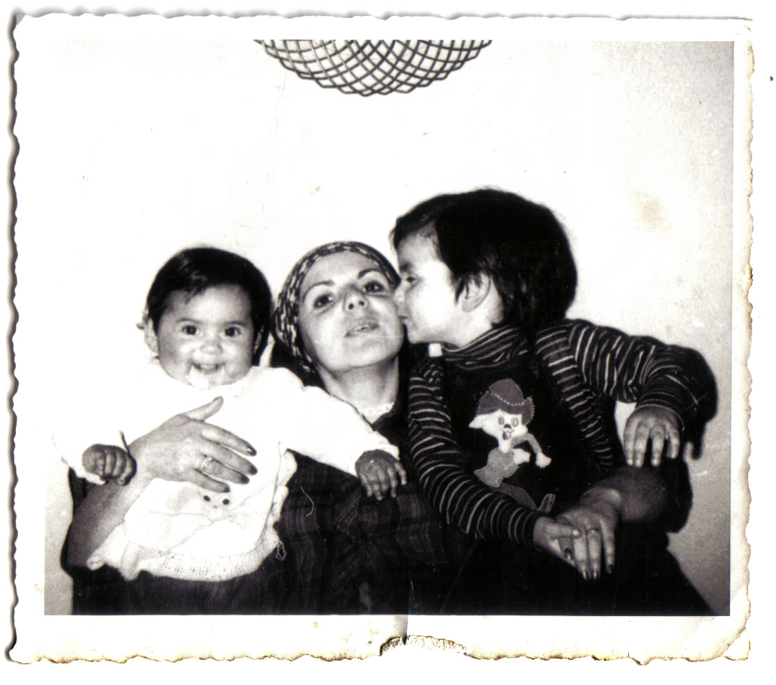 a black and white po shows an older man, two younger women, a  and a baby girl