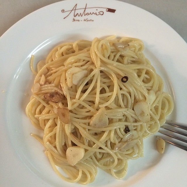 a pasta dish on a white plate with a fork