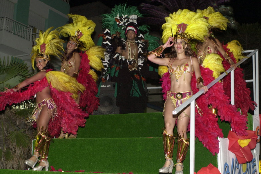 a group of women in elaborately dressed costume