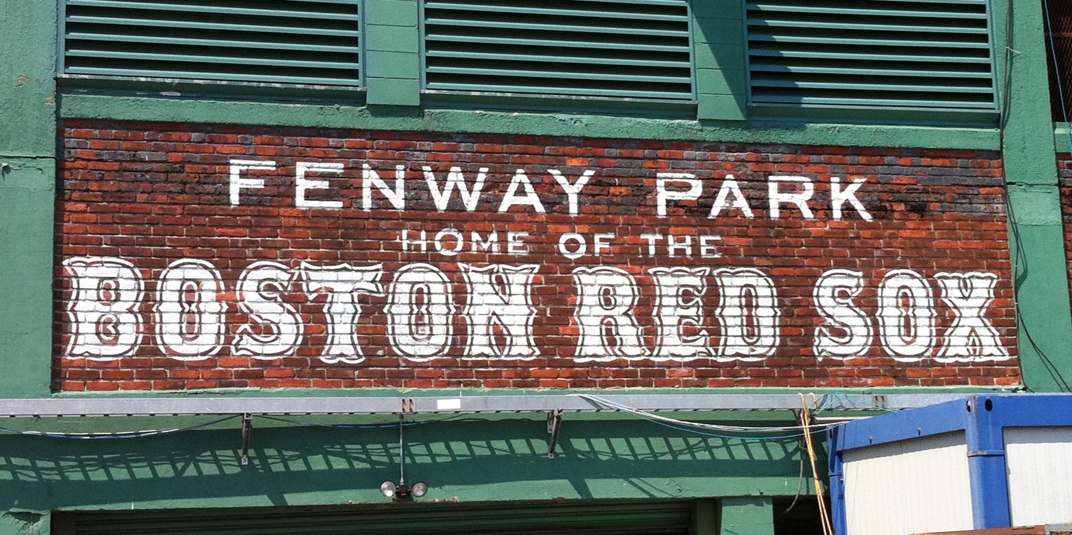 this is a sign advertising fenway park home of the boston red sox