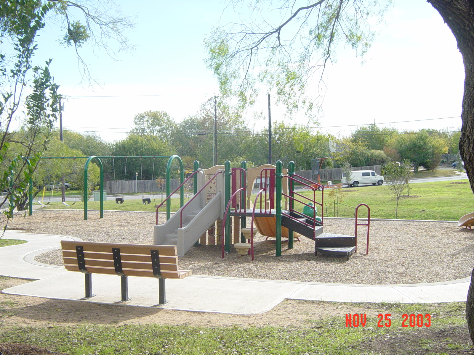 a small playground set with some s playing on the slide