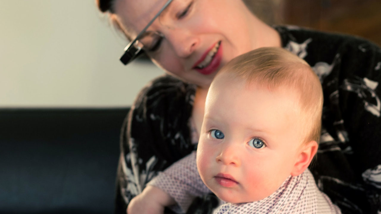 an image of a woman that is holding a baby