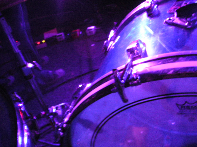 this is a drum set in front of a purple background