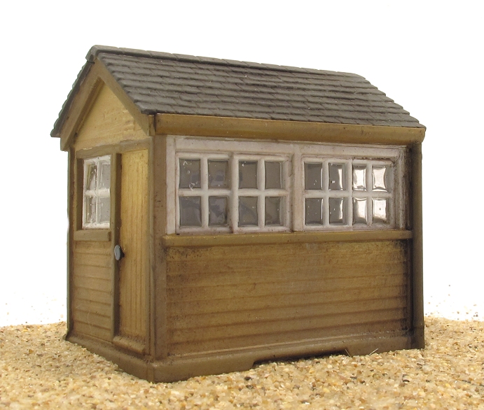 a wooden toy shed with its door open