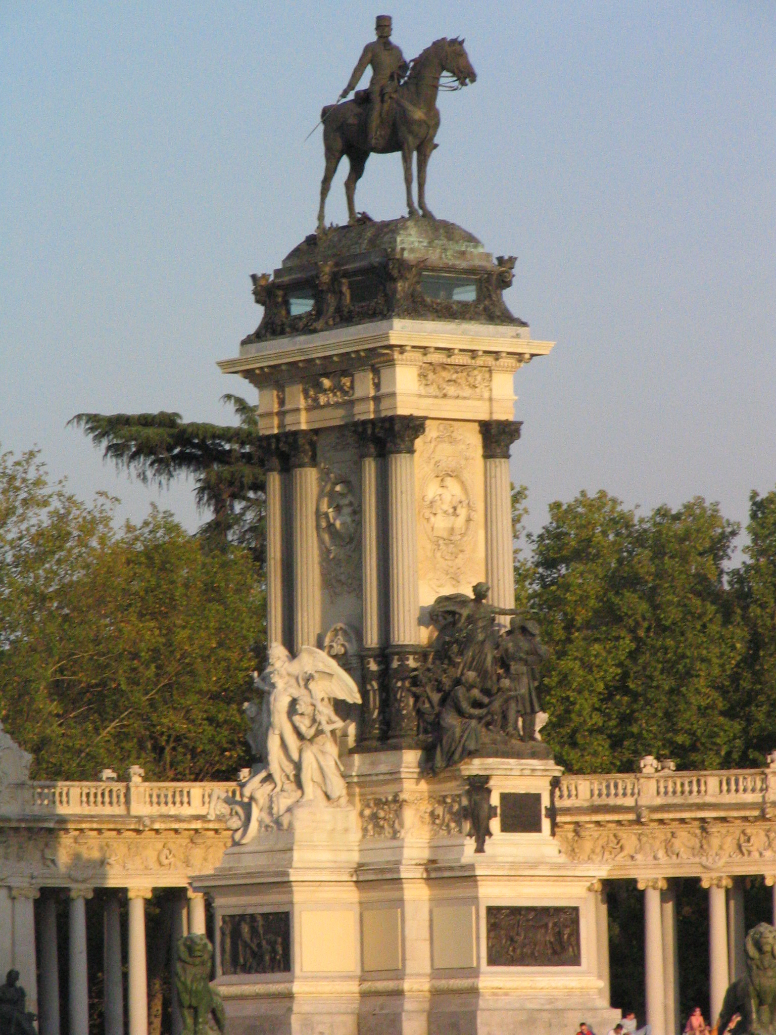 statue of man with a horse and rider on top of monument