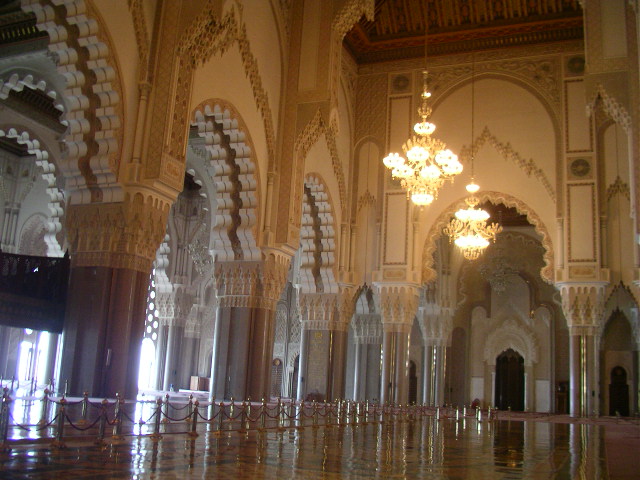 the inside of an ornate building is reflected in the mirror