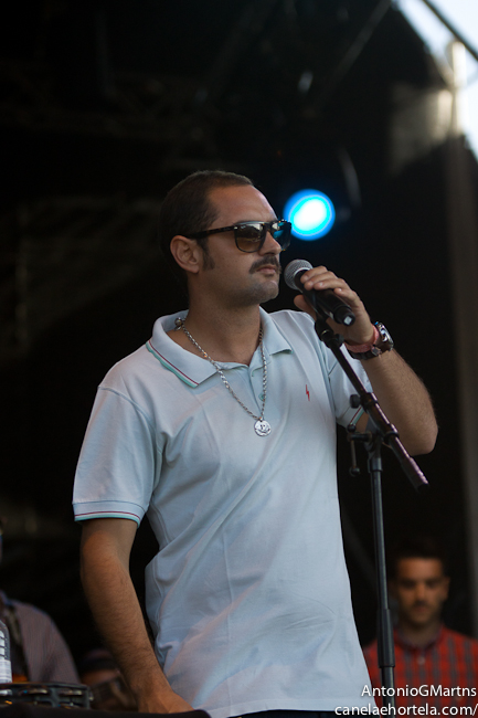 man standing on stage while holding a microphone