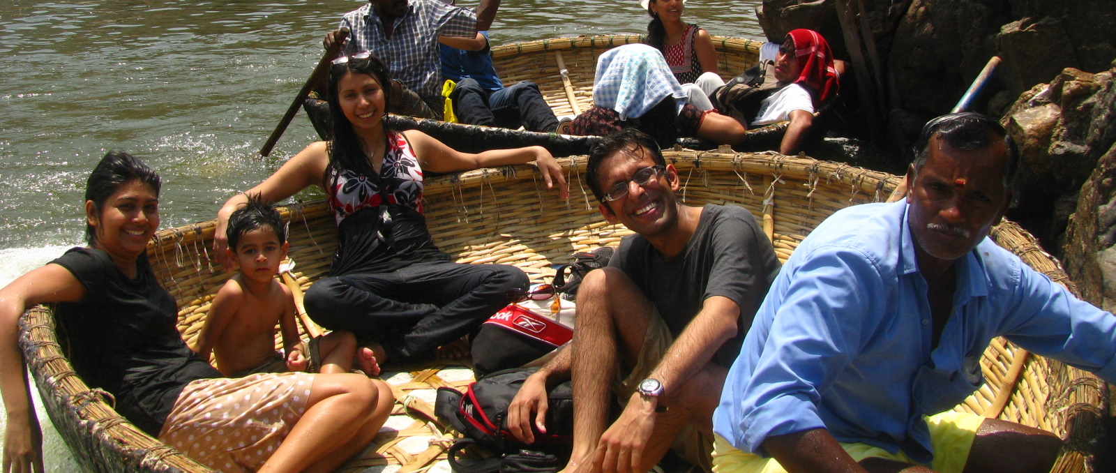 group of people in basket in water near shore