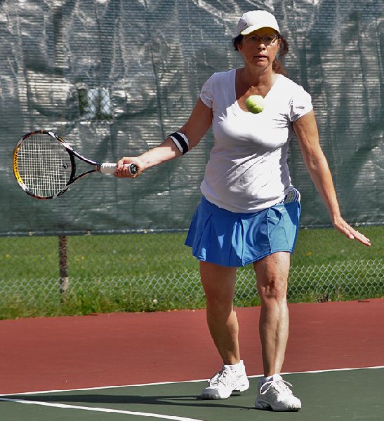 a women who is getting ready to hit the ball