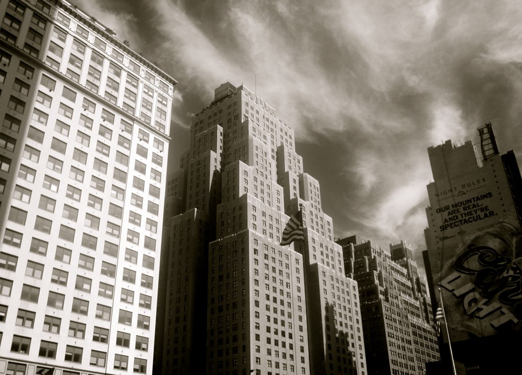 several skyscrs against a cloudy sky