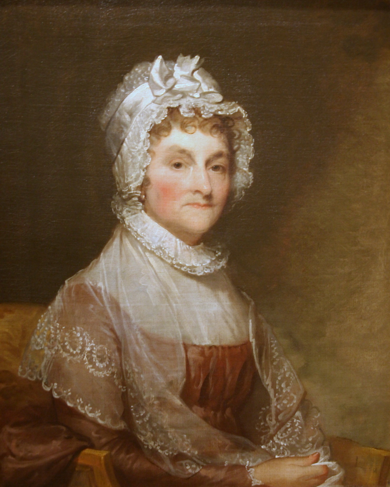 a portrait of a woman in a bonnet