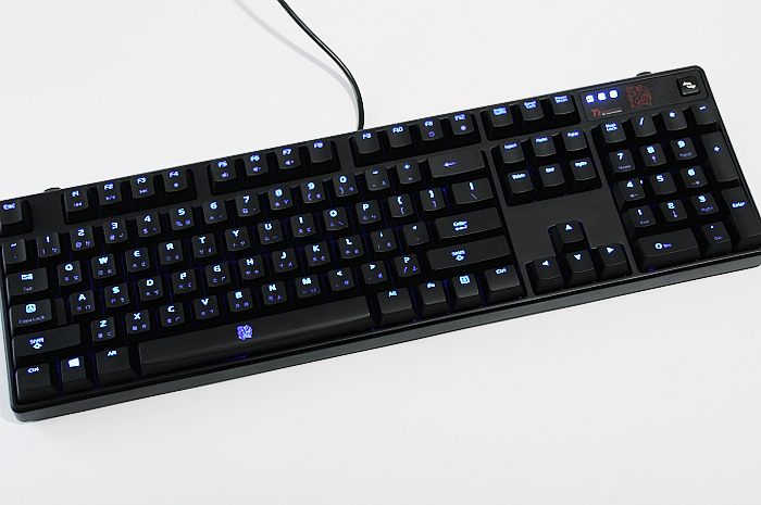 a black keyboard with blue and white keys