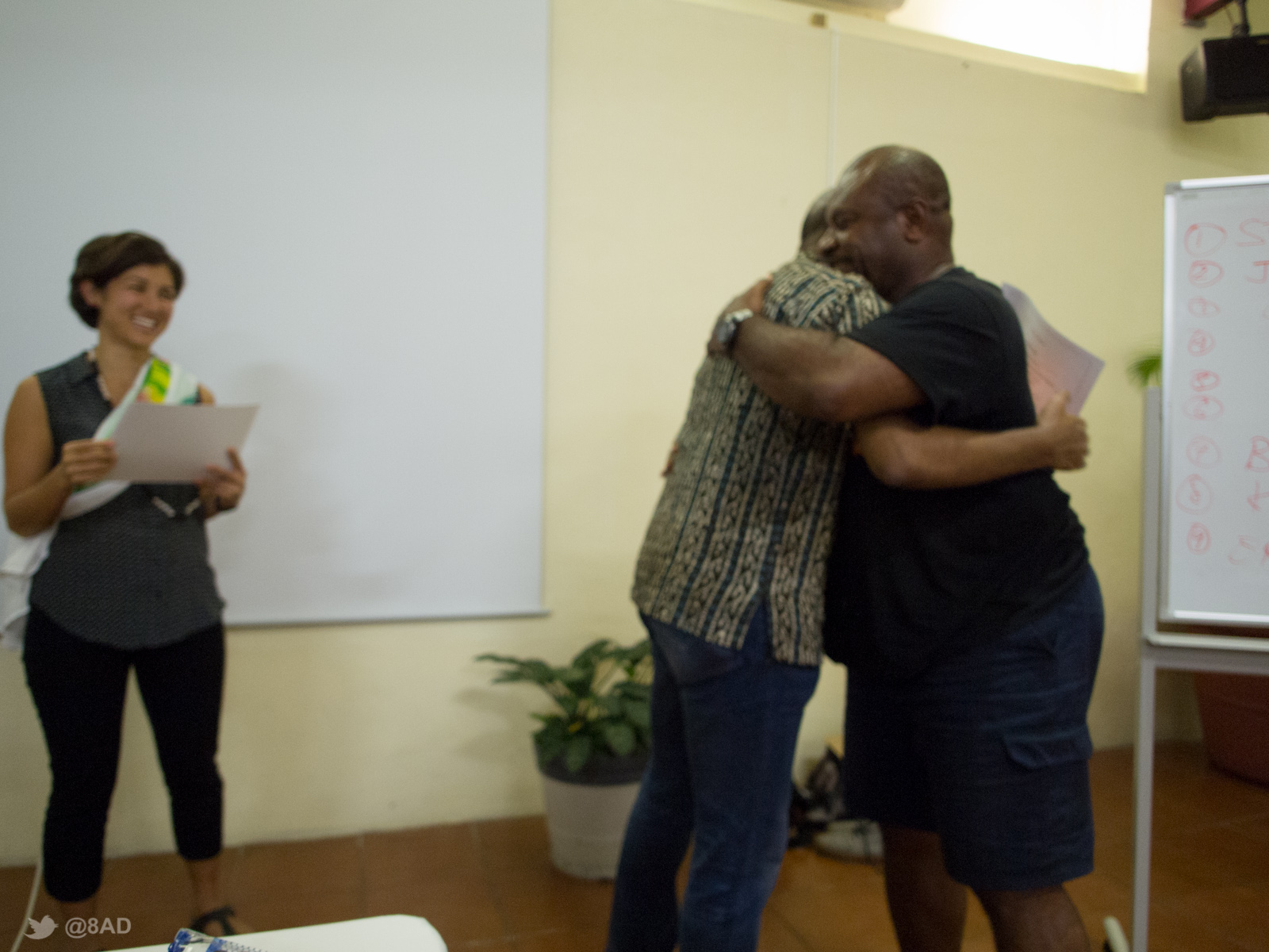 a man hugging a woman standing in a room