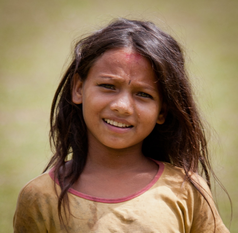 a  smiles in front of the camera