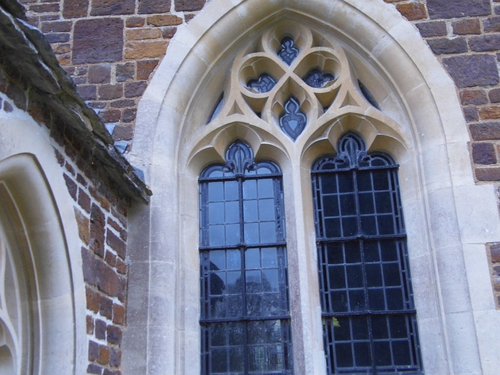 an old building with a gothic window in the center