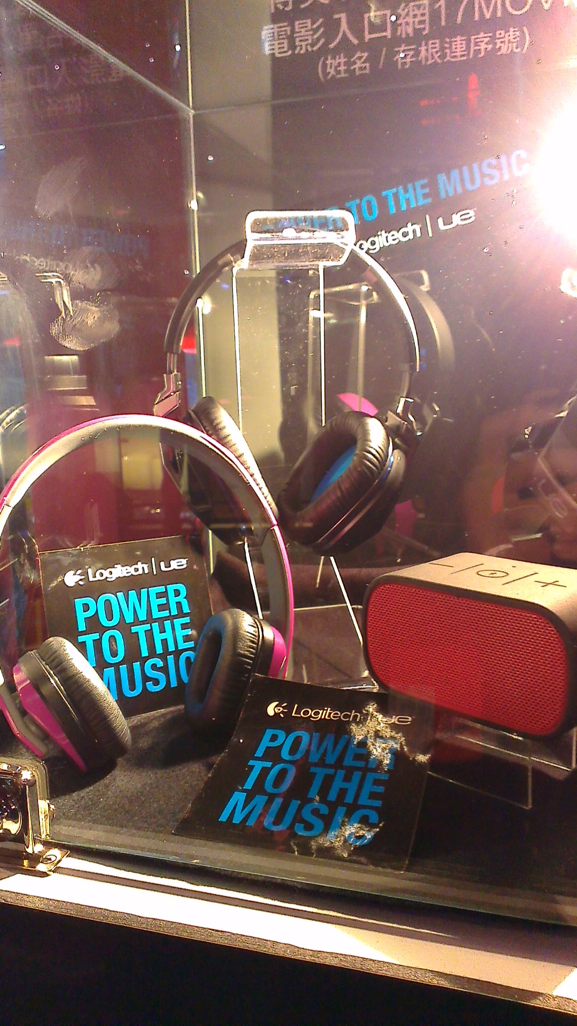 headphones and other accessories displayed in a display