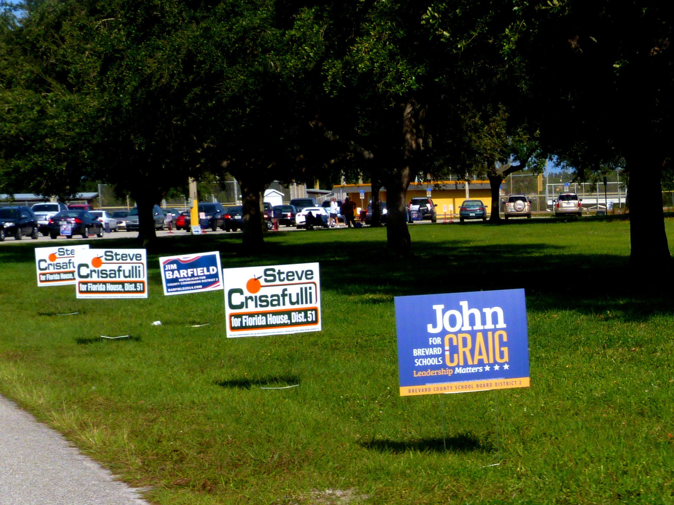 a bunch of political signs laying out in the grass