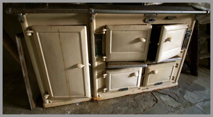 a kitchen stove with several different oven doors