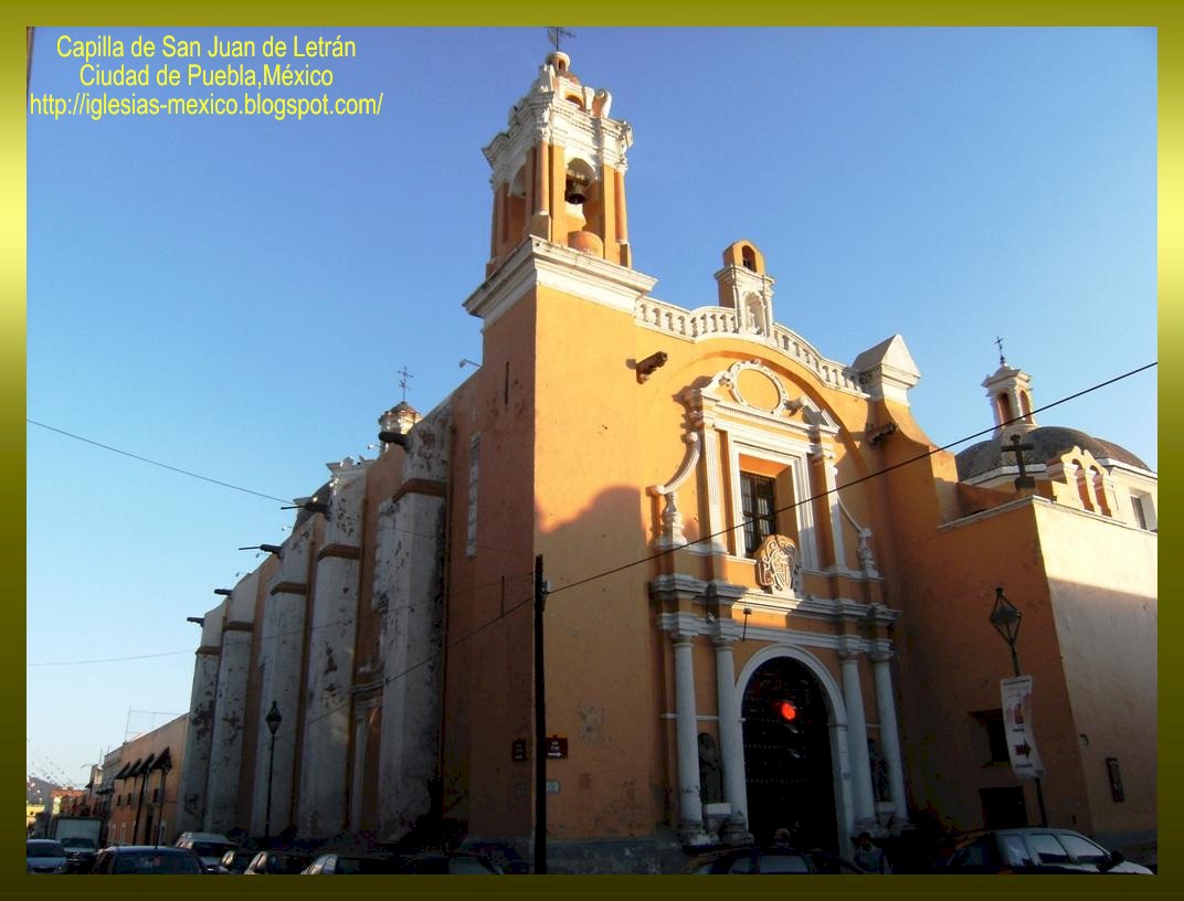 an orange church with white trim on its side