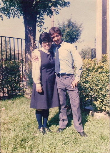 an old picture of a couple standing together