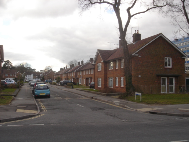 a row of brick houses lining an empty street