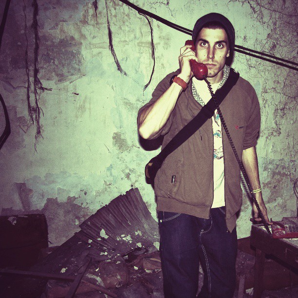 a man is on a cell phone and in an abandoned building
