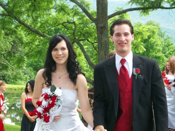 this is a picture of a man and woman dressed in red ties