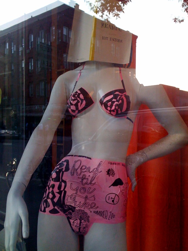 a mannequin with an underwear behind it