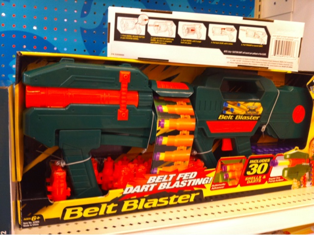 a nerf gun is on display in a toy store