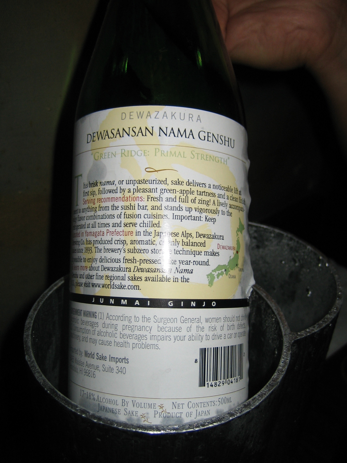 a close up of a bottle of wine in a tin