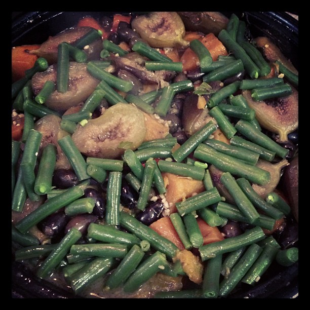 a pan filled with vegetables cooking in broth
