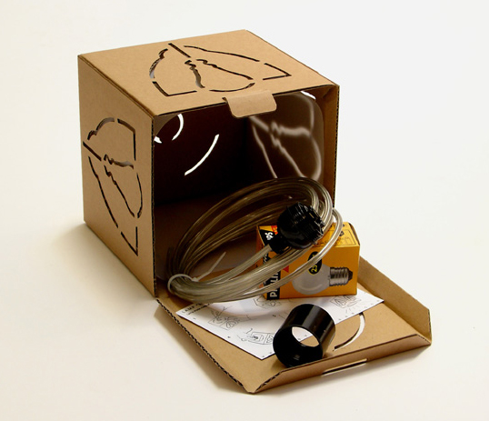 a cardboard box is opened and has some wires in it