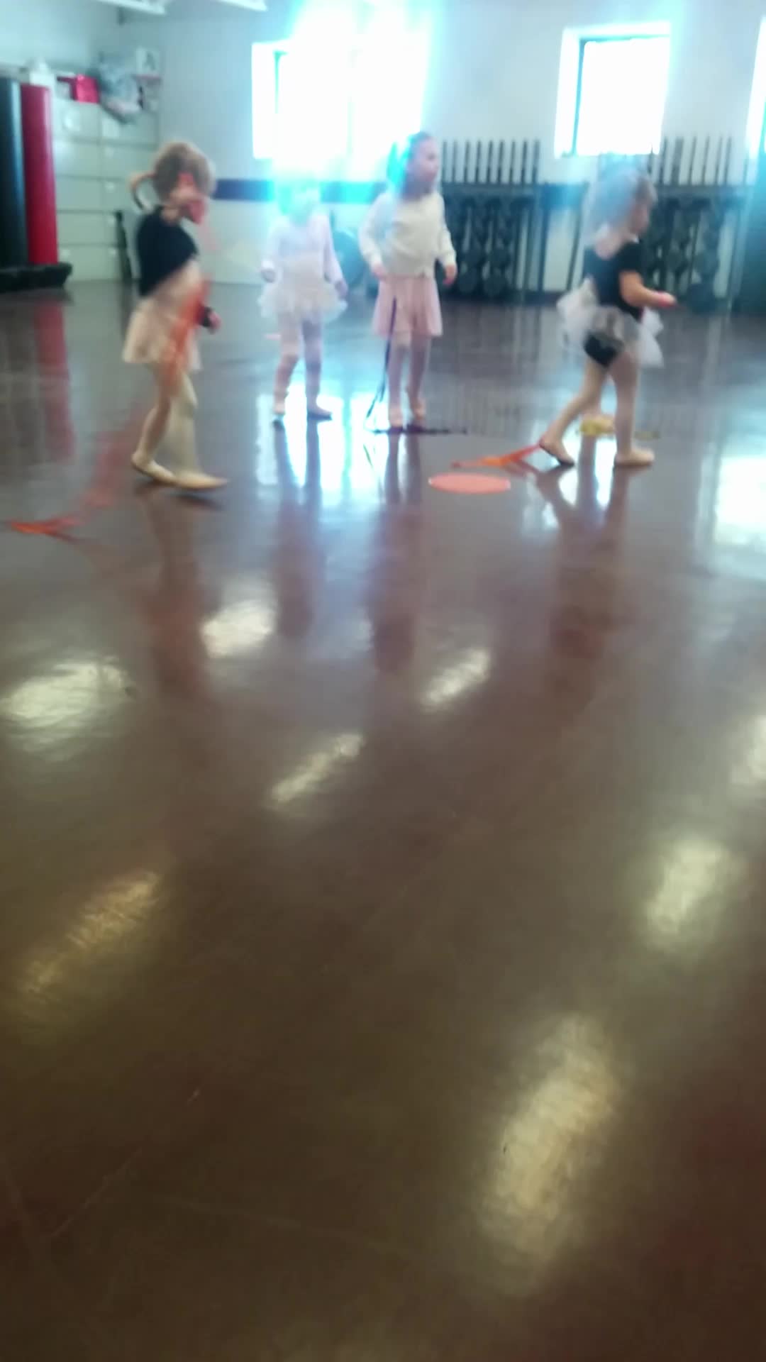 a couple of little girls playing with an object