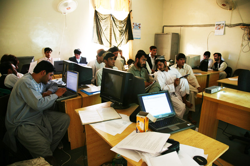 several students sit at their desks in a class