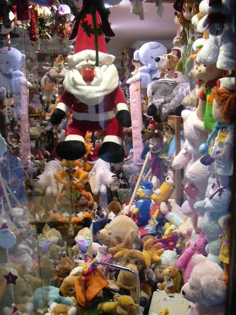 a big bunch of stuffed animals inside of a case