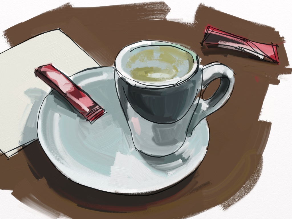 a cup of coffee and some lipstick sitting on a plate