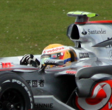 a racing car with an odd helmet in front