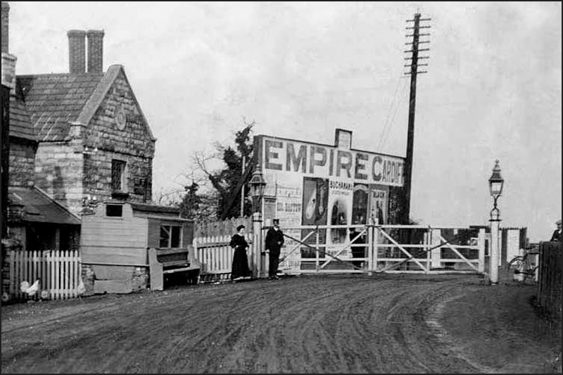 an old po of a couple standing outside a building