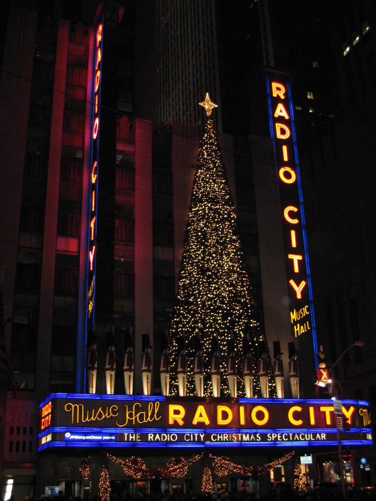 an outdoor radio city christmas tree is lit up