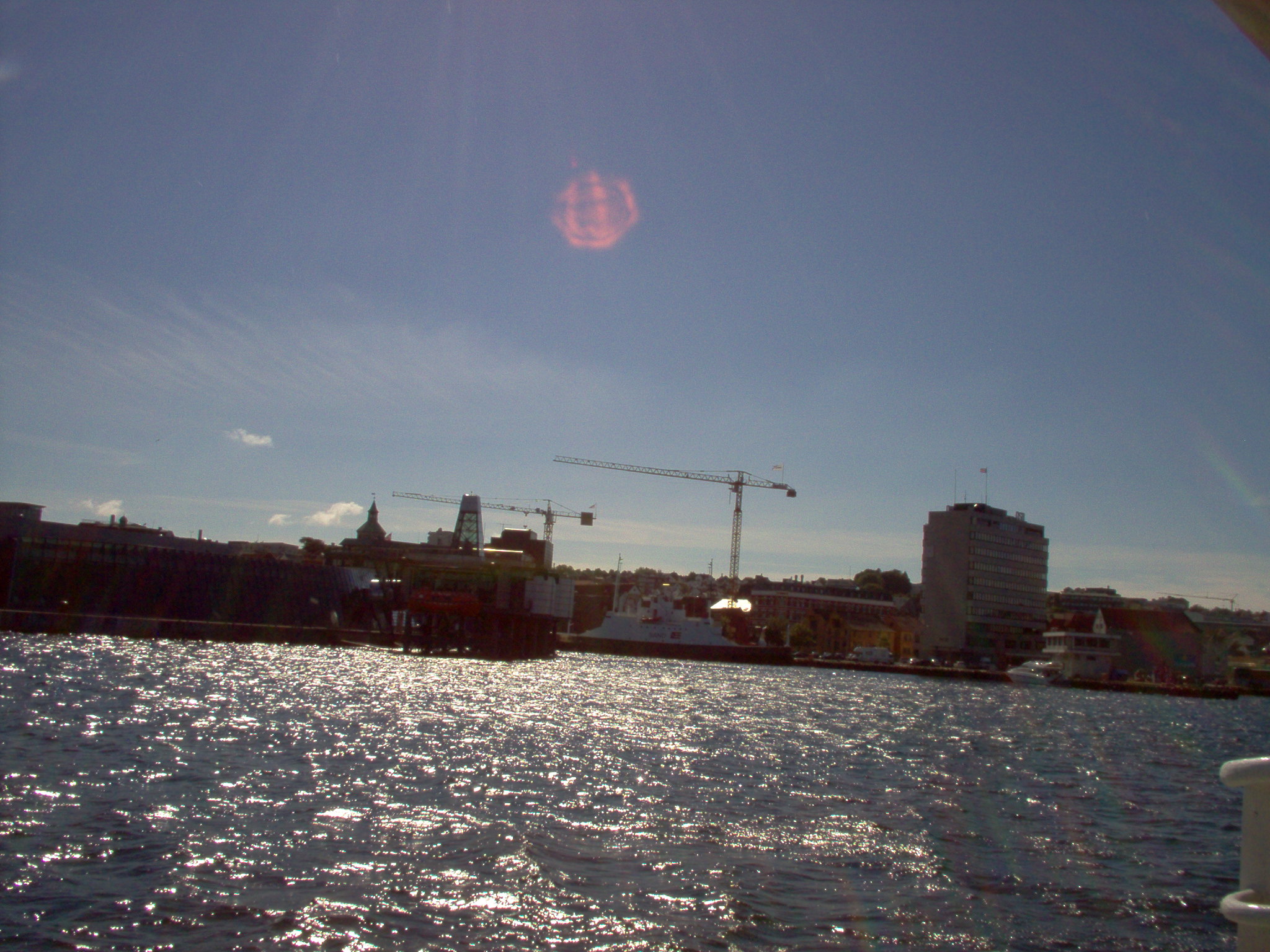 a picture of some buildings sitting on a pier in a harbor