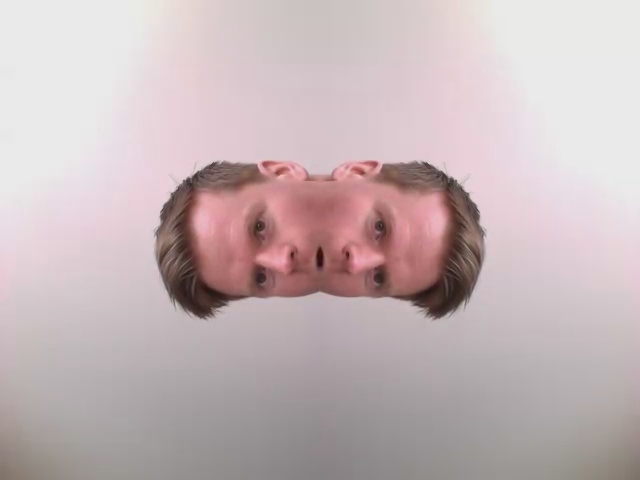 man's head has double faces and is standing in the air