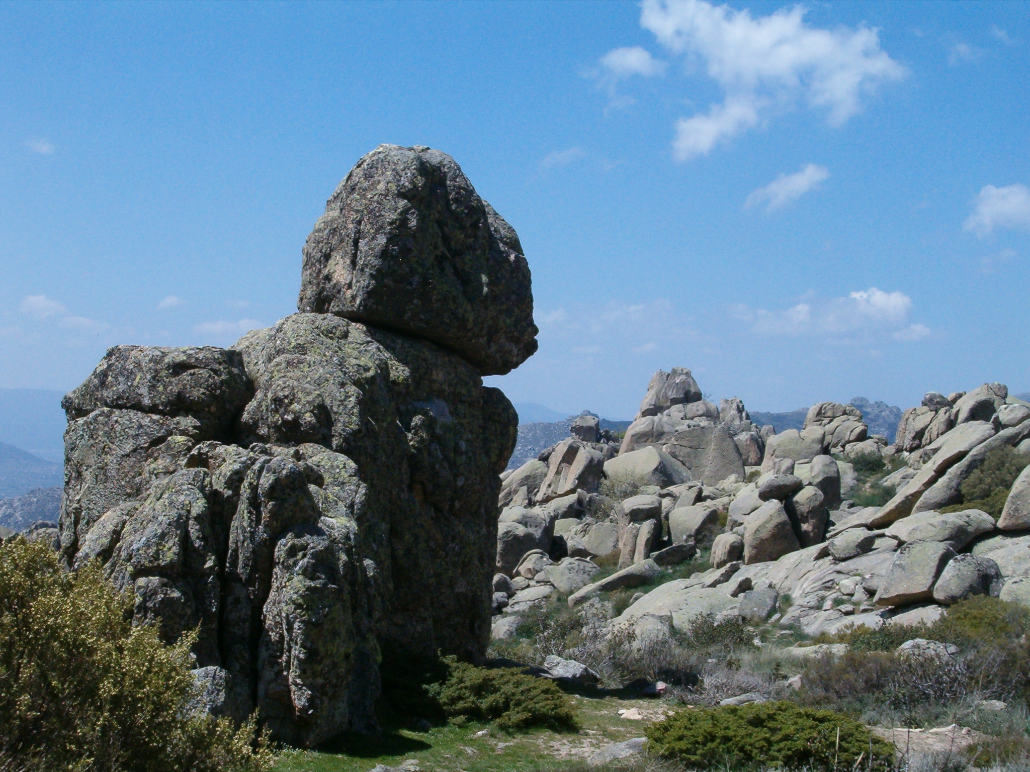 the giant rocks are standing on the mountain top