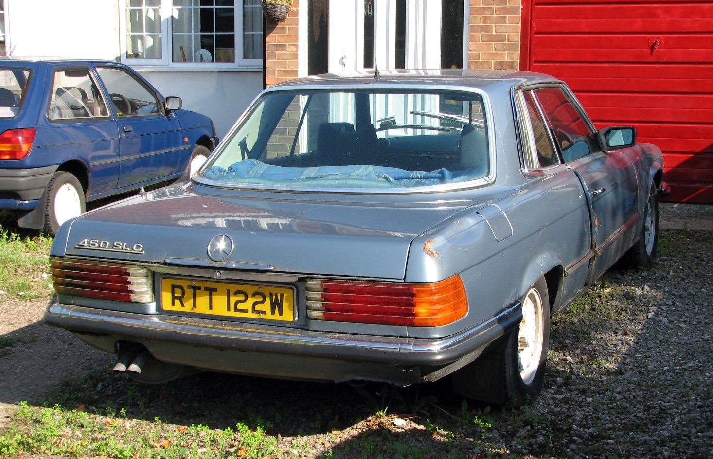 a mercedes benz estate car parked on the side of a road