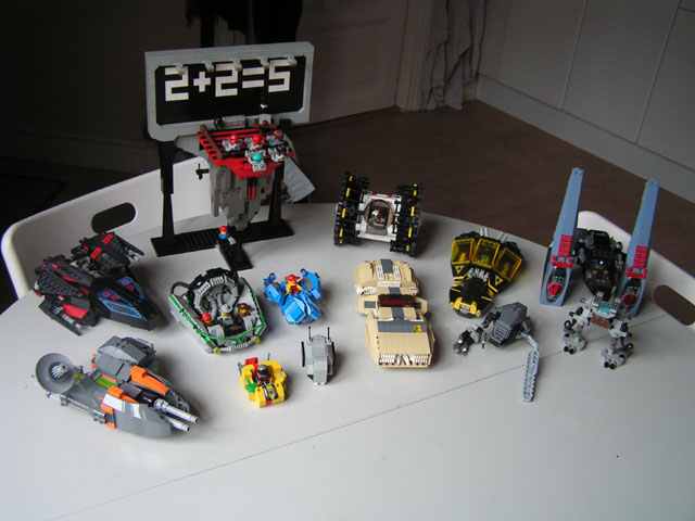 a table topped with lego cars and vehicles