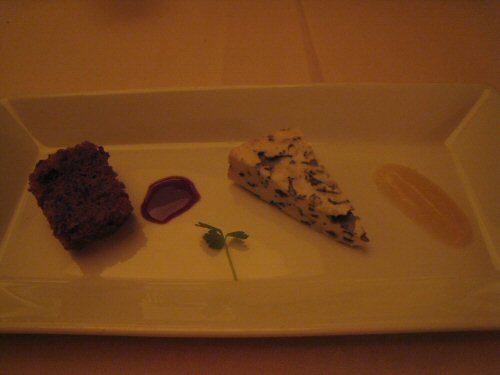 a square plate with three desserts on top